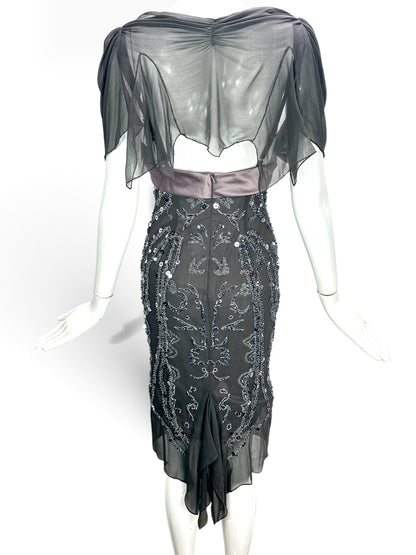 Back view of a Cannonball and Tilly charcoal grey midi evening dress with sequin embellishments and sheer draped sleeves