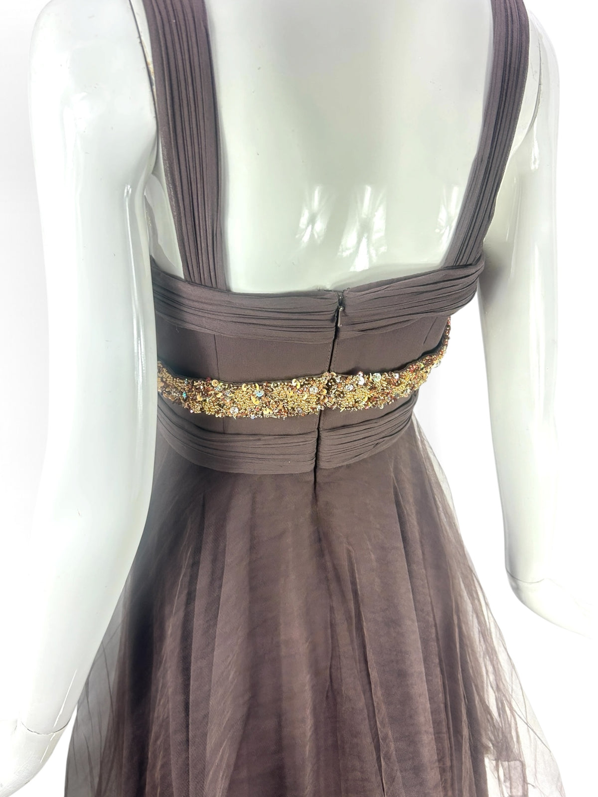 Cannonball and Tilly chocolate brown sleeveless evening dress with gold and bronze beaded waist detail on a mannequin