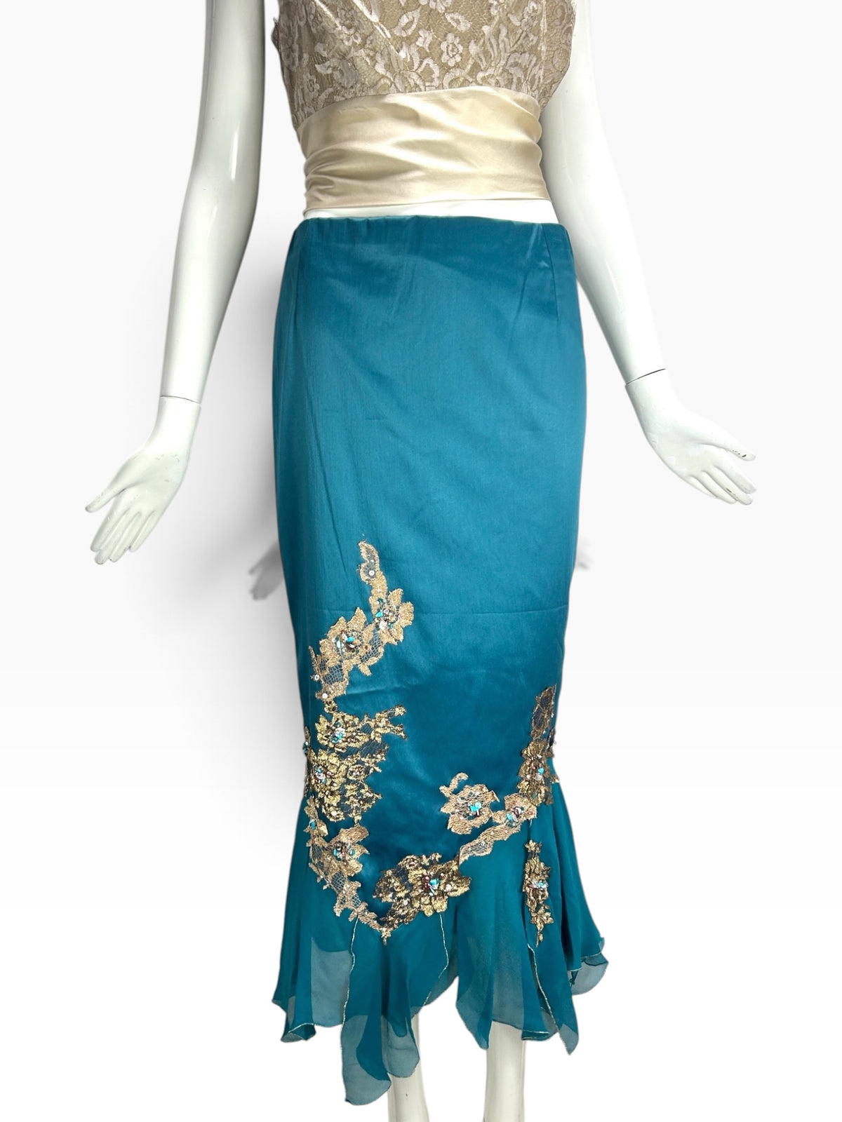 Cannonball and Tilly teal mermaid formal skirt with gold floral embroidery, sequins, and a ruffled hemline on mannequin