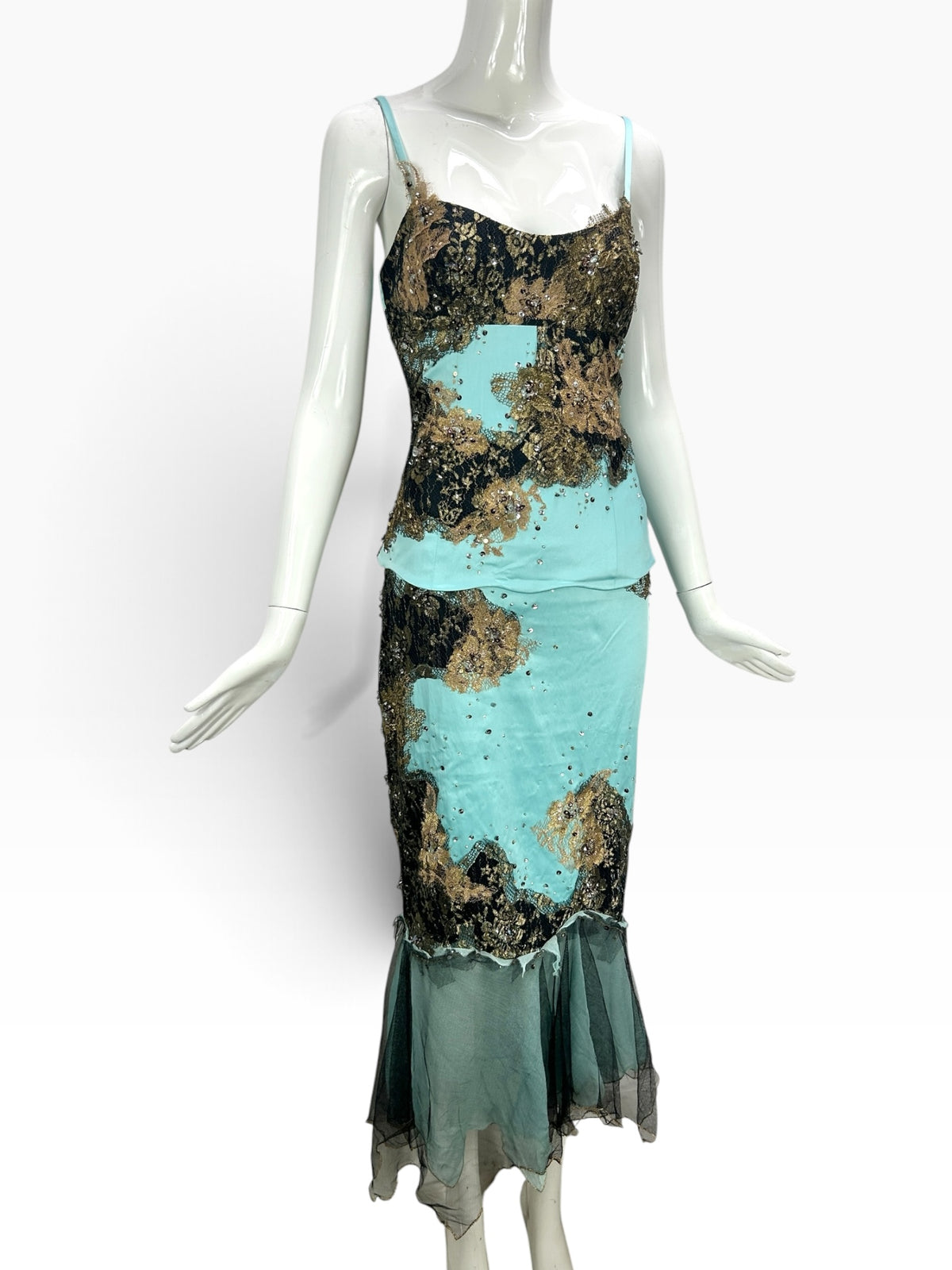 Cannonball and Tilly turquoise and black mermaid evening dress with gold lace overlay, sequins, and tulle hemline.